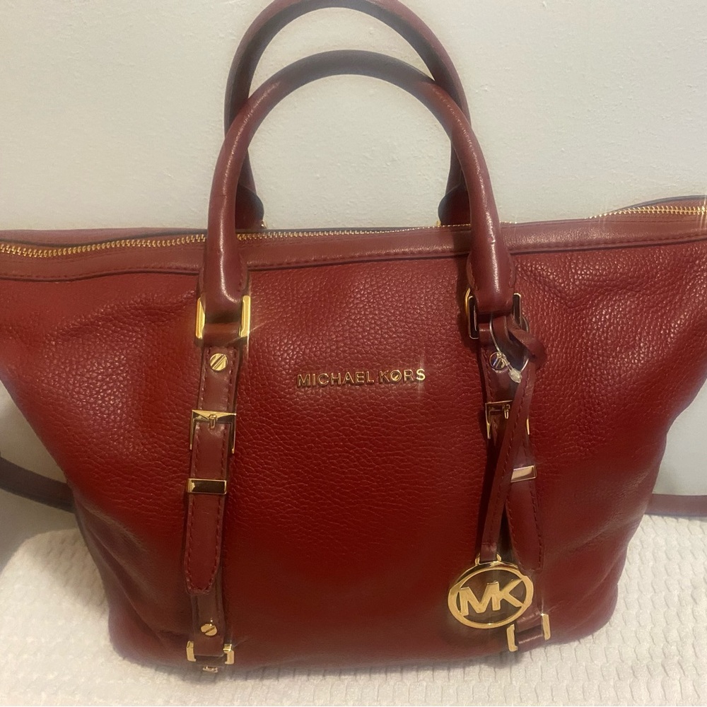 Wine color large Michael Kros purse.